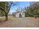Charming single-story home boasts a gravel driveway, neutral siding, and a well-maintained yard at 700 Ross Rd, Lillington, NC 27546