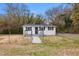 Charming home with a well-kept yard and a secure fence, perfect for outdoor activities and relaxation at 700 Ross Rd, Lillington, NC 27546