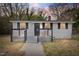 Charming front exterior featuring a quaint porch and neutral siding, exuding classic curb appeal at 700 Ross Rd, Lillington, NC 27546