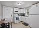 Bright kitchen with modern appliances, ample cabinet space, and a cozy dining area, perfect for cooking and entertaining at 700 Ross Rd, Lillington, NC 27546