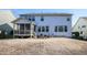 Exterior view of a backyard, including a screened porch and grilling area, ready for entertainment at 708 Barley Green St, Wake Forest, NC 27587