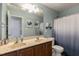 Traditional bathroom features a double vanity, large mirror, and coordinated fixtures and finishes at 708 Barley Green St, Wake Forest, NC 27587