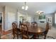 Dining room connecting to the living room, fireplace and a large dining table at 708 Barley Green St, Wake Forest, NC 27587