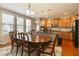 Dining area and kitchen with stainless steel appliances and a large window at 708 Barley Green St, Wake Forest, NC 27587
