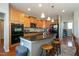 Kitchen featuring an island with bar stools and stainless steel appliances at 708 Barley Green St, Wake Forest, NC 27587