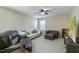 Comfortable living room with neutral walls, a ceiling fan, and plush seating for relaxing and entertaining at 708 Barley Green St, Wake Forest, NC 27587
