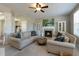 Cozy living room with a fireplace, neutral tones, stylish sofas, and decorative accents at 708 Barley Green St, Wake Forest, NC 27587