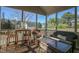 Comfortable screened porch with stylish furniture creates the perfect spot for relaxation and entertaining at 708 Barley Green St, Wake Forest, NC 27587