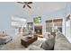 Open-concept living room with fireplace and view to the kitchen at 8720 Deerland Grove Dr, Raleigh, NC 27615
