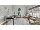 Comfortable home office with hardwood floors, neutral walls, and a cozy seating area for work or study at 8720 Deerland Grove Dr, Raleigh, NC 27615