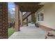 A spacious patio with a picnic table and play equipment under a wooden staircase at 8720 Deerland Grove Dr, Raleigh, NC 27615