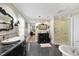 Bathroom showcasing a glass-enclosed shower, dual vanities, and modern design at 920 W Johnson St, Raleigh, NC 27605