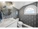 Sophisticated powder room with modern vanity, patterned wallpaper, and stylish fixtures at 920 W Johnson St, Raleigh, NC 27605