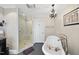 Elegant bathroom featuring a clawfoot tub and separate glass-enclosed shower at 920 W Johnson St, Raleigh, NC 27605