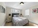 Calm bedroom with hardwood floors, neutral colors, and windows letting in ample natural light at 920 W Johnson St, Raleigh, NC 27605