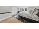 Well-lit bedroom with hardwood floors, neutral walls and updated furnishings at 920 W Johnson St, Raleigh, NC 27605