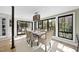 Sunlit dining room with a large window, modern chandelier, and a stylish table set at 920 W Johnson St, Raleigh, NC 27605