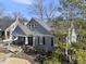 Charming home boasts a cozy front porch, mature landscaping, and classic architectural details at 920 W Johnson St, Raleigh, NC 27605