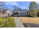 Inviting home with a landscaped front yard and cozy front porch on a sunny day at 920 W Johnson St, Raleigh, NC 27605