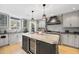 Modern kitchen features granite countertops, stainless steel appliances, and a large island at 920 W Johnson St, Raleigh, NC 27605