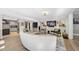 Open-concept living room with a kitchen view, light hardwood floors, and a modern design at 920 W Johnson St, Raleigh, NC 27605