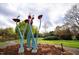 Public art installation in a park with walking paths and mature trees, perfect for leisurely strolls at 920 W Johnson St, Raleigh, NC 27605