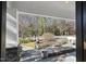 View from porch into front yard with stone pavers and mature trees at 920 W Johnson St, Raleigh, NC 27605