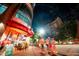 Restaurant exterior with neon lights and outdoor seating, providing a lively ambiance at 920 W Johnson St, Raleigh, NC 27605