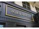 Elegant gold lettering on a black storefront sign that reads 'FOX & BAILEY' at 920 W Johnson St, Raleigh, NC 27605