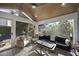 Relaxing sunroom features vaulted wood ceilings, plenty of natural light, and comfortable seating at 920 W Johnson St, Raleigh, NC 27605