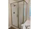 Modern bathroom with glass shower, white subway tile, and bronze fixtures at 9249 Miranda Dr, Raleigh, NC 27617