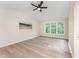 Spacious bedroom with natural light, ceiling fan, and luxury vinyl flooring at 9249 Miranda Dr, Raleigh, NC 27617