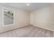 Comfortable bedroom with a window providing natural light and views of the neighborhood at 9249 Miranda Dr, Raleigh, NC 27617