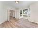 Home office with a bay window, wood floors, and glass doors that lead to the foyer at 9249 Miranda Dr, Raleigh, NC 27617