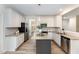 Contemporary kitchen showcasing granite counters, stainless appliances, and a stylish island at 9249 Miranda Dr, Raleigh, NC 27617