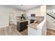 Modern kitchen featuring granite countertops, stainless steel appliances, and a center island at 9249 Miranda Dr, Raleigh, NC 27617