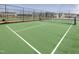 A view of an outdoor pickleball court surrounded by new homes at 1016 Channel Drop Lp, Zebulon, NC 27597
