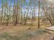 Landscaped backyard featuring plenty of space and a wooden deck at 1041 Limerick Ln, Durham, NC 27713