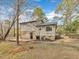 Backyard featuring a wooden deck with a door leading into the home at 1041 Limerick Ln, Durham, NC 27713