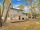 Backyard featuring a wooden deck, lush trees, and partial fencing at 1041 Limerick Ln, Durham, NC 27713