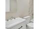 Powder room showing a white vanity with a light-colored sink and modern faucet at 1041 Limerick Ln, Durham, NC 27713