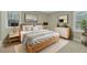 Serene bedroom with a natural wood bed frame, soft gray bedding, and modern decor at 1041 Limerick Ln, Durham, NC 27713