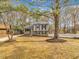 Exterior view of house with gray siding, black shutters, and a white picket fence at 1041 Limerick Ln, Durham, NC 27713