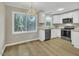 Modern kitchen featuring stainless steel appliances, granite countertops, and abundant cabinet space at 1041 Limerick Ln, Durham, NC 27713