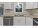 Updated kitchen with stainless appliances and granite counters under a window view at 1041 Limerick Ln, Durham, NC 27713