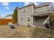 View of the backyard with a patio, wooden fence, and a small fire pit at 1104 Pebblestone Dr, Durham, NC 27703