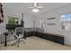 Versatile bedroom with a ceiling fan, natural light, and ample space for a desk and storage at 1104 Pebblestone Dr, Durham, NC 27703