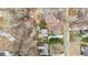 An aerial view of a property shows its layout, landscaping, and positioning within the neighborhood at 115 N Oakland Dr, Mebane, NC 27302