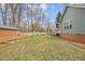 Large backyard with green grass, shed and swing-set at 115 N Oakland Dr, Mebane, NC 27302