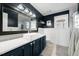 Bathroom with a custom vanity and a shower with glass doors at 115 N Oakland Dr, Mebane, NC 27302